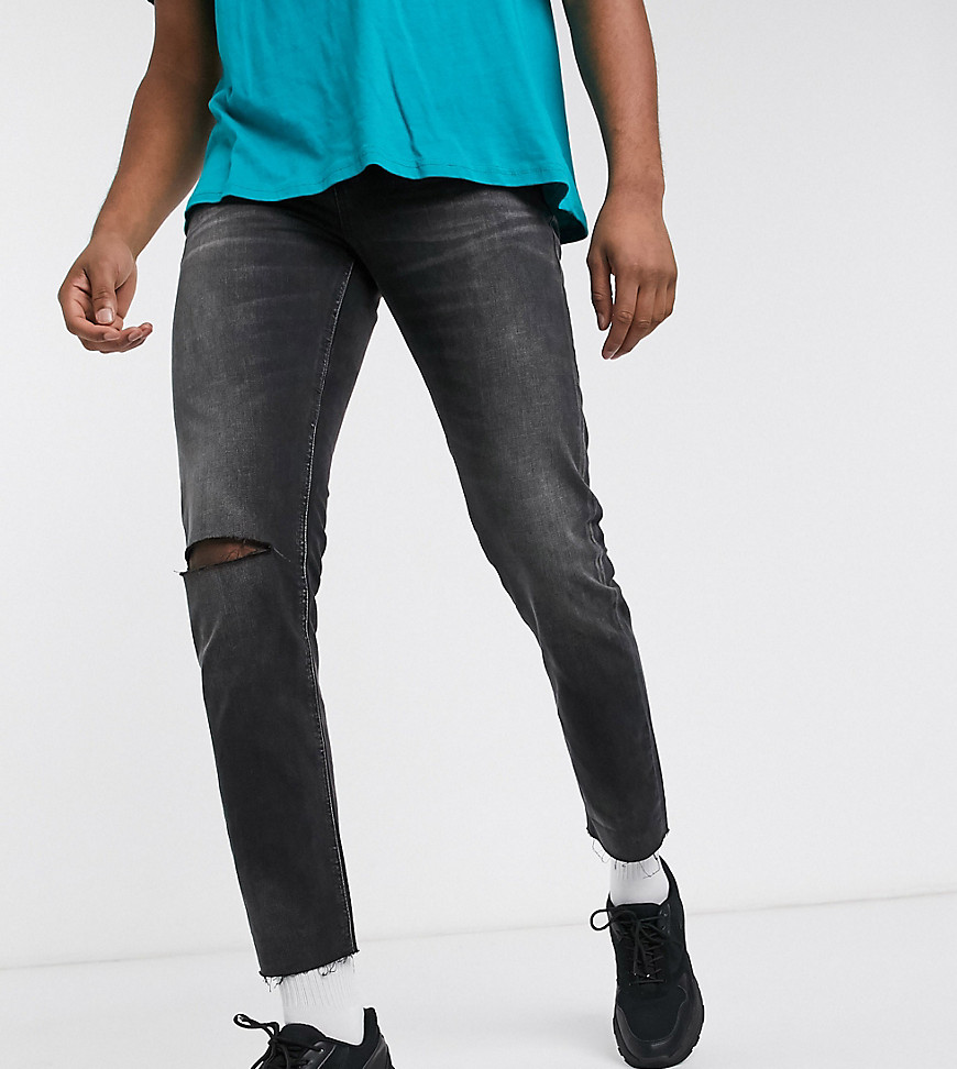 ASOS DESIGN Tall - Jeans slim cropped nero slavato con fondo grezzo e strappi sul fondo
