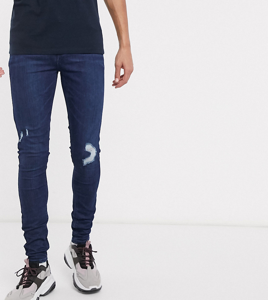 ASOS DESIGN Tall - Jeans spray on power stretch blu lavaggio scuro con abrasioni