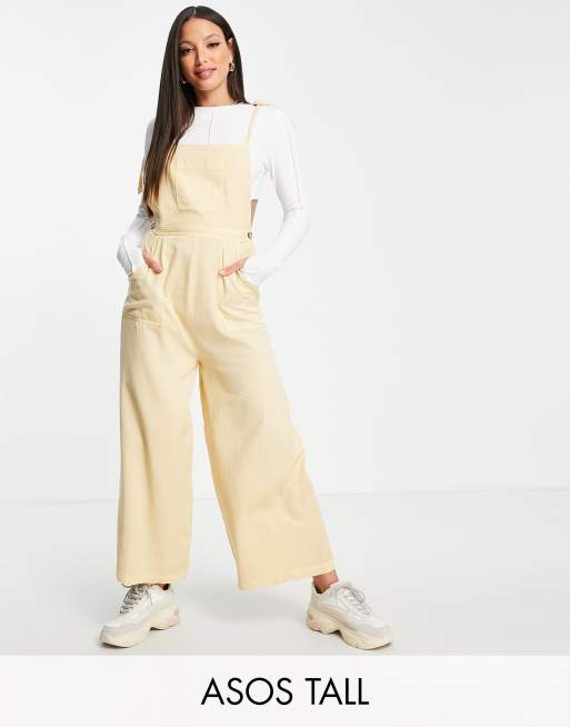 ASOS DESIGN Tall - Jumpsuit met textuur en gestrikte schouderbandjes in kiezelkleur met wassing