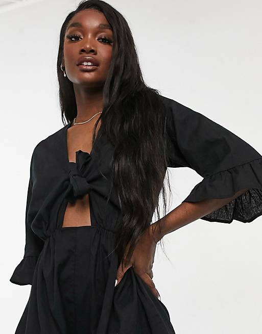  tall knot front frill sleeve playsuit in black 
