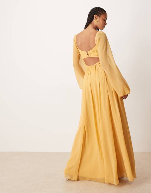 ASOS DESIGN Tall long sleeve cut out maxi dress with ruched skirt in mustard