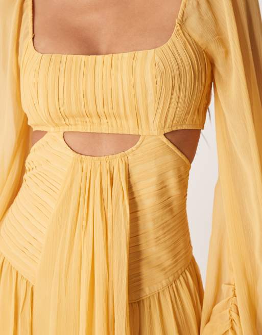 ASOS DESIGN Tall long sleeve cut out maxi dress with ruched skirt in mustard