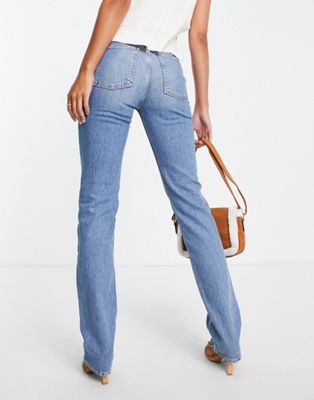 ASOS DESIGN mid rise comfort stretch straight leg jeans in midwash