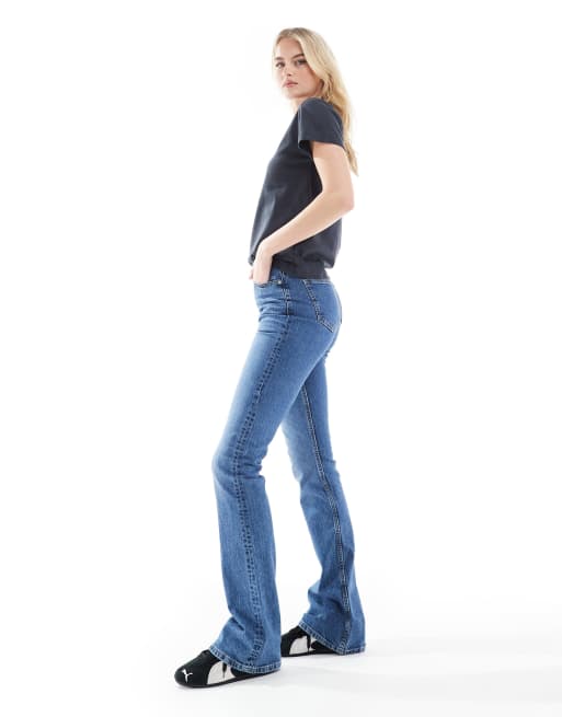 ASOS DESIGN Tall mid rise flare jeans in mid wash