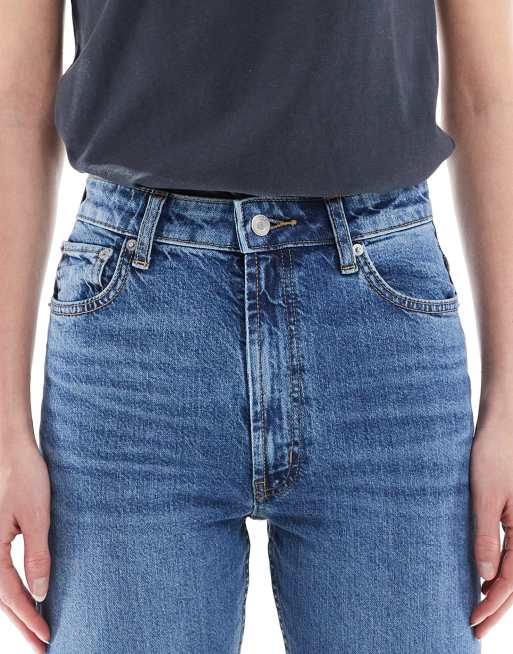 ASOS DESIGN Tall mid rise flare jeans in mid wash