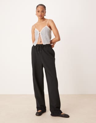 ASOS DESIGN Tall - Oversize-Jogginghose in Schwarz mit umgeschlagenem Saum