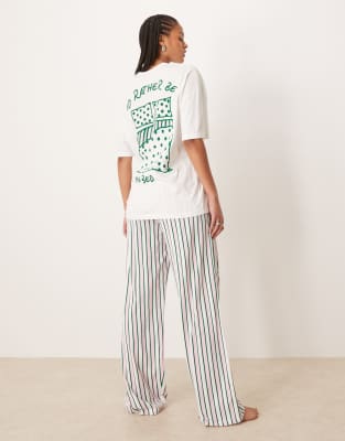 ASOS DESIGN Tall – Oversize-T-Shirt mit Bett-Grafik und weite Hose mit Streifen - view 1