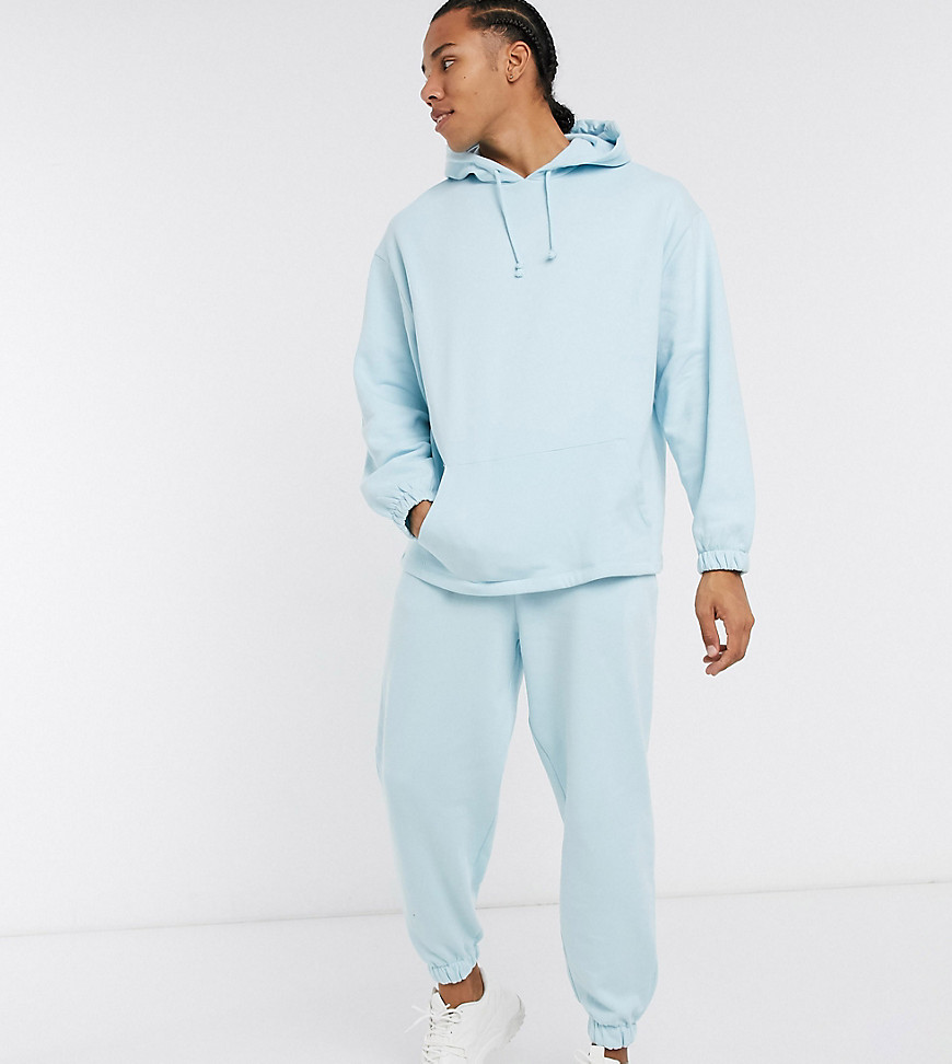 ASOS DESIGN Tall oversized cropped sweatpants in pastel blue with contrast stitch