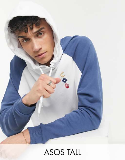ASOS DESIGN Tall oversized raglan hoodie in white with washed blue sleeves chest line drawing
