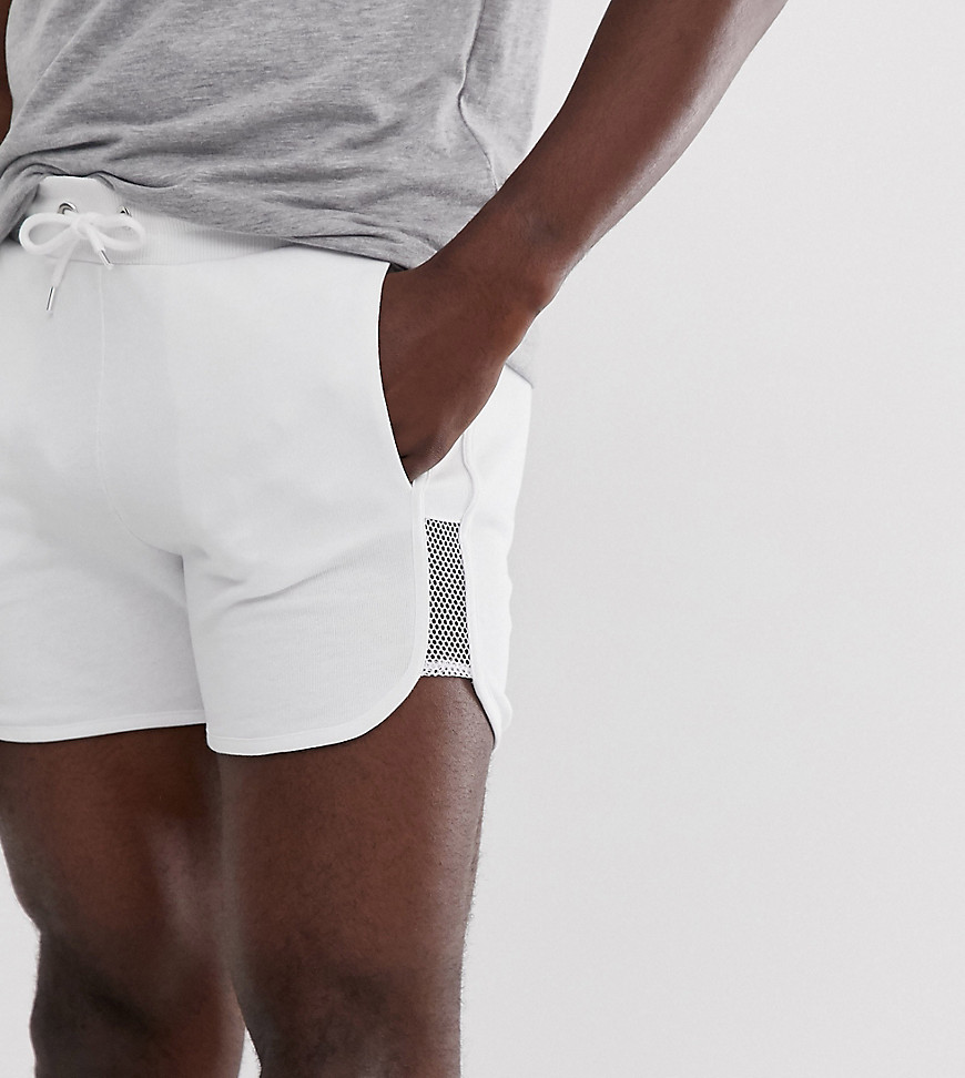 ASOS DESIGN Tall - Pantaloncini da running in jersey con pannelli a rete bianchi-Bianco