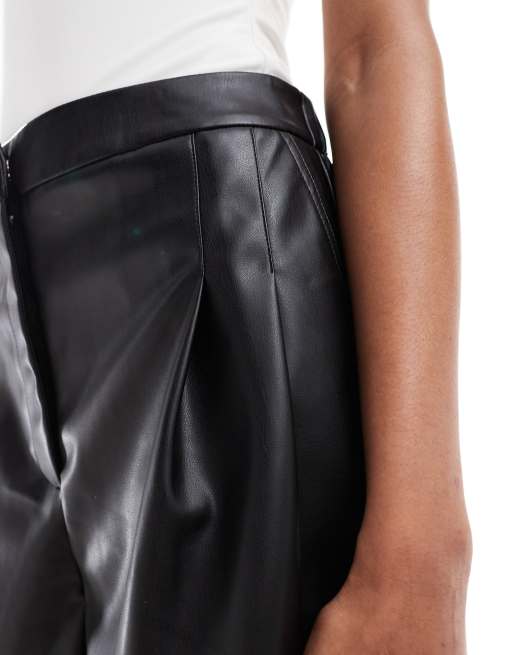 ASOS DESIGN Tall pleat detail faux leather shorts in black ASOS