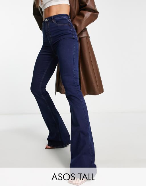 ASOS DESIGN flared jeans in dark blue with split hem