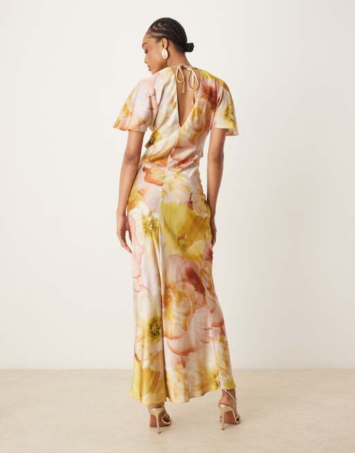 ASOS DESIGN Tall satin knot detail cutout midi dress in golden yellow floral