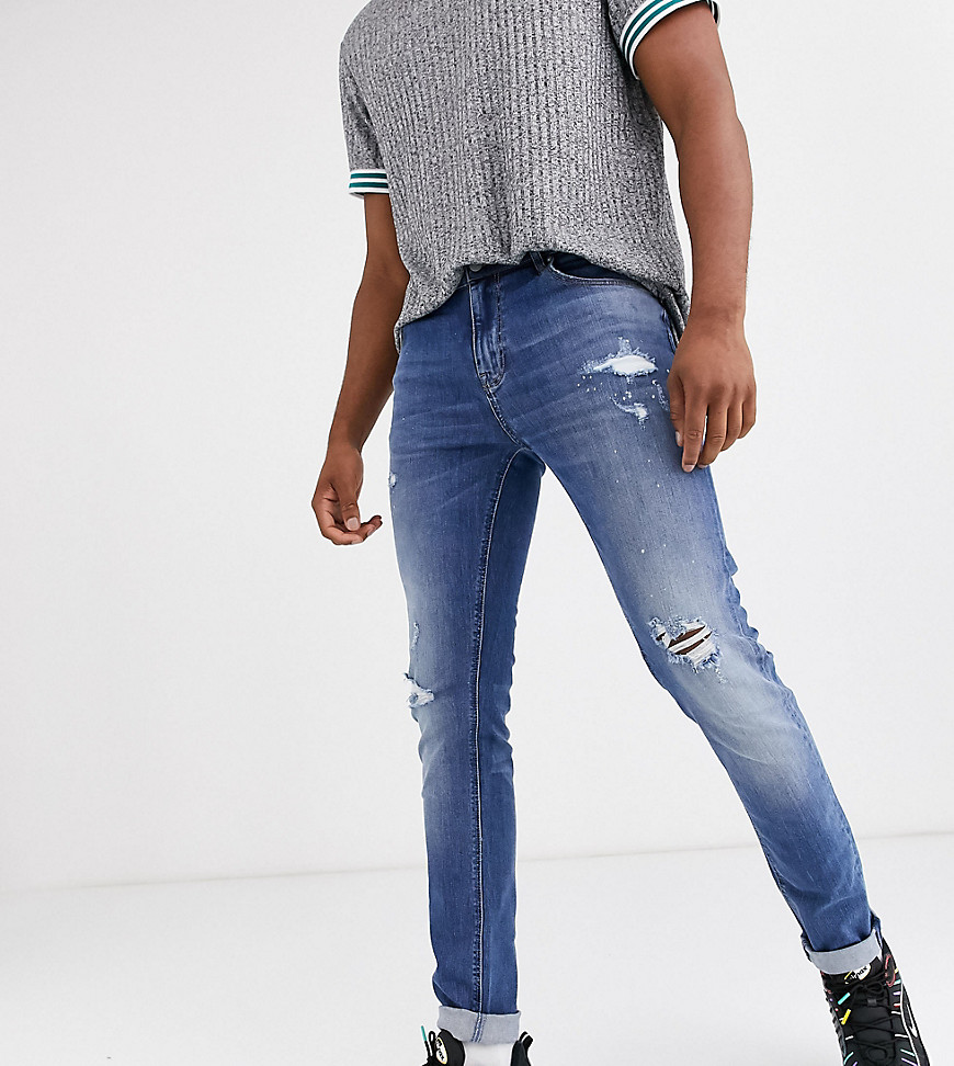 ASOS DESIGN Tall skinny jeans in mid wash blue with rips and destroy