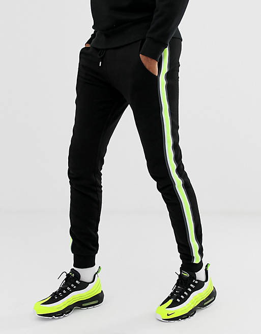 ASOS DESIGN Tall skinny sweatpants with neon side stripe taping in ...