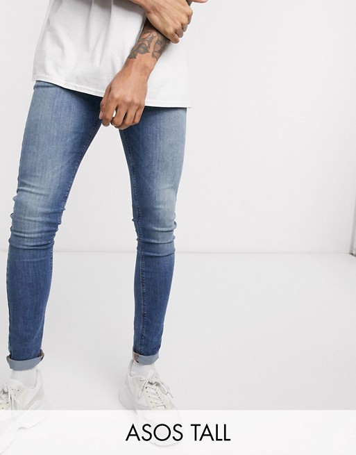ASOS DESIGN Tall spray on jeans in power stretch denim in mid wash blue