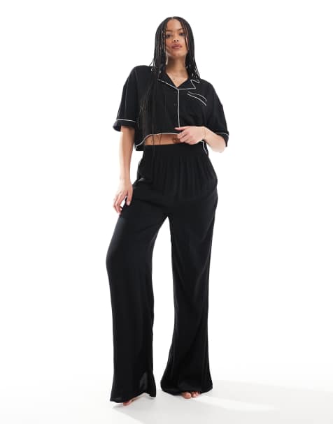 ASOS DESIGN Tall super soft slinky wide leg pajama pants in black with contrast binding - view 1