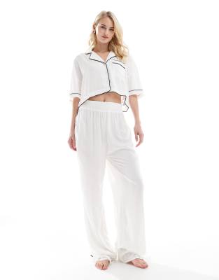 ASOS DESIGN Tall super soft slinky wide leg pajama pants in white with contrast binding