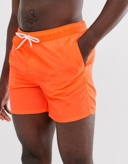 Orange Men Shorts For Swimming Stock Photo - Download Image Now