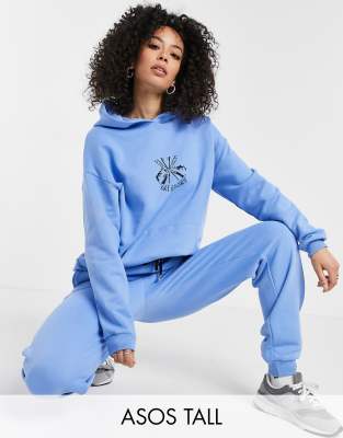 ASOS DESIGN Tall Trainingsanzug mit Oversize Kapuzenpullover und Oversize Jogginghose mit Ski Motiv in Blau ASOS