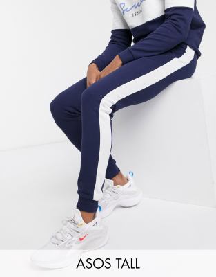 blue sweatpants with white stripe