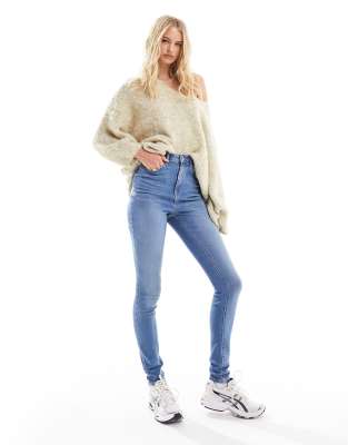 ASOS Tall ASOS DESIGN Tall ultimate skinny jeans in mid blue