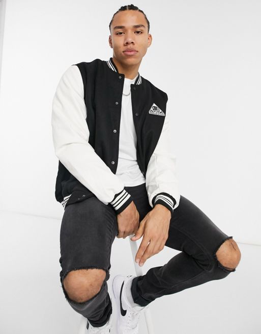ASOS DESIGN varsity jacket in black with faux leather sleeves