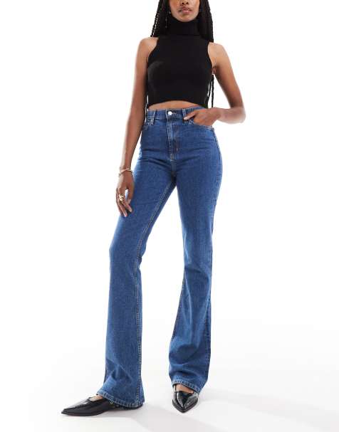 ASOS DESIGN Tall - Wijd uitlopende jeans met halfhoge taille in middenblauw - view 1