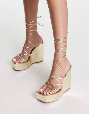 ASOS DESIGN Tanon tie leg wedges in gold