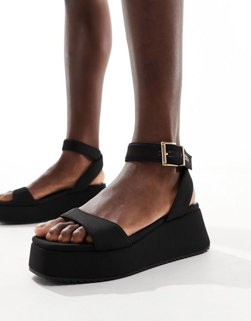 FhyzicsShops DESIGN - Tantoo - Platte sandalen met plateauzool in zwart