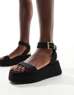 ASOS DESIGN - Tantoo - Sandalen in Schwarz mit flacher Plateausohle