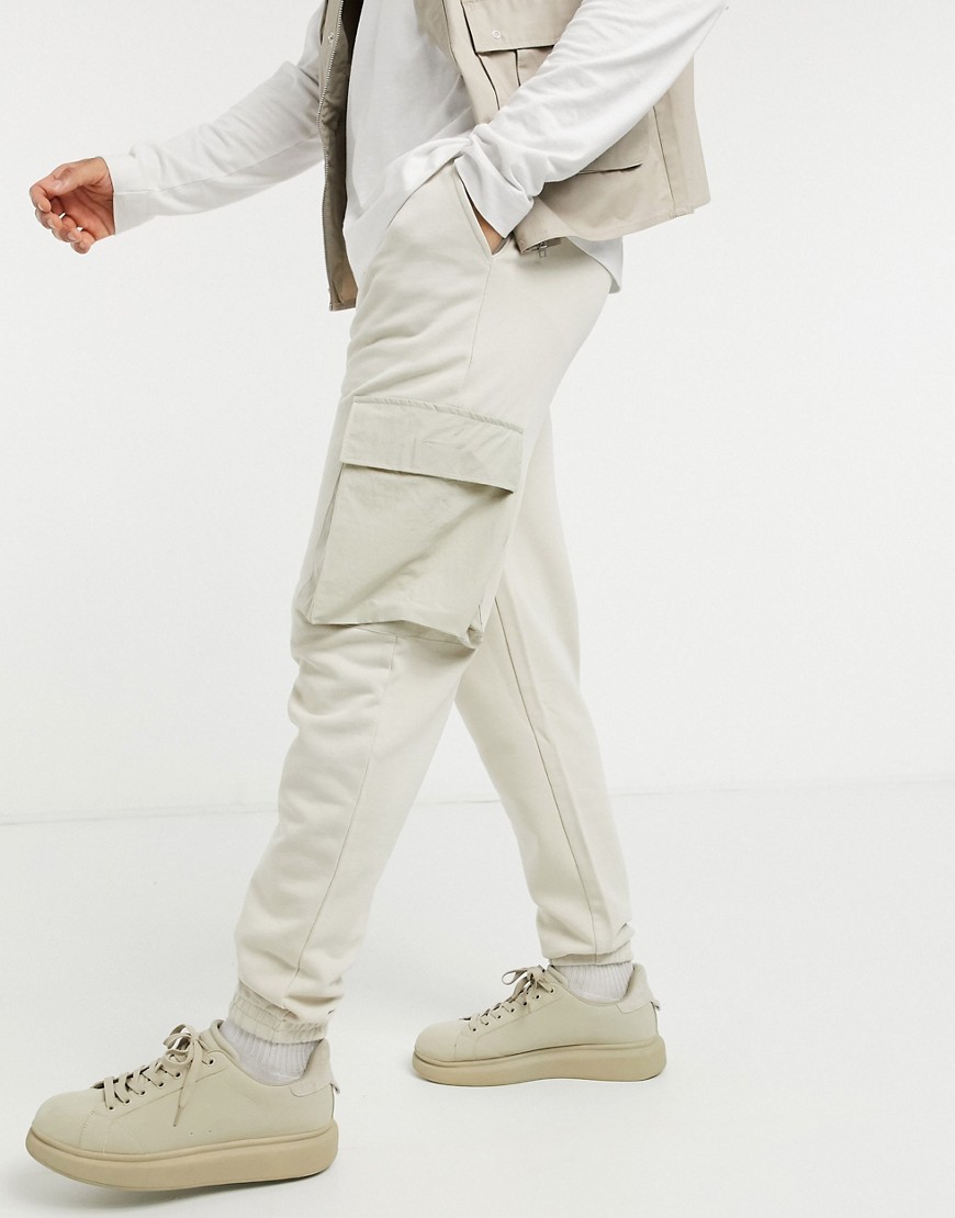 ASOS DESIGN tapered cargo joggers with woven cargo pockets in beige-Neutral