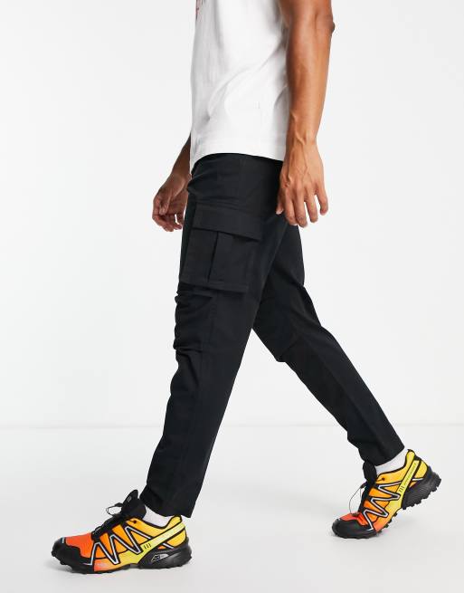 ASOS DESIGN washed moto cargo pants with 3D pockets in brown