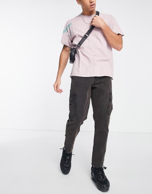 ASOS DESIGN tapered cargo pants in canvas with acid wash in black