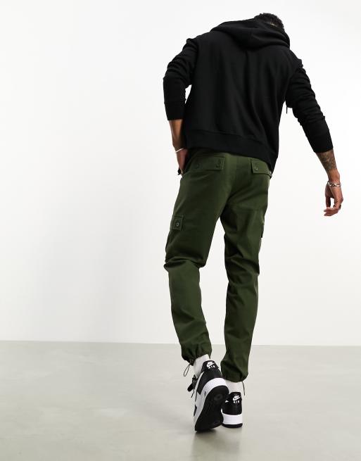 ASOS DESIGN tapered cargo pants in black with toggles