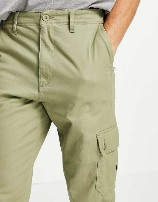 ASOS DESIGN tapered cargo pants in light green with toggles