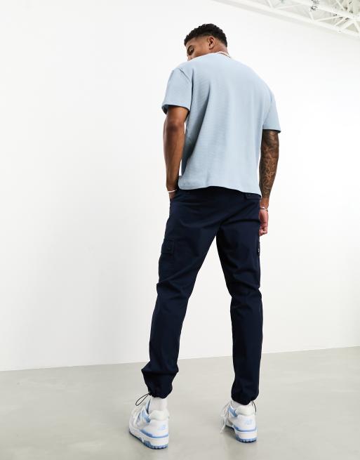 ASOS DESIGN tapered cargo pants in navy