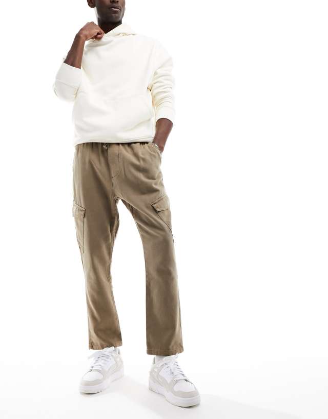 ASOS DESIGN tapered cargo pants in washed brown