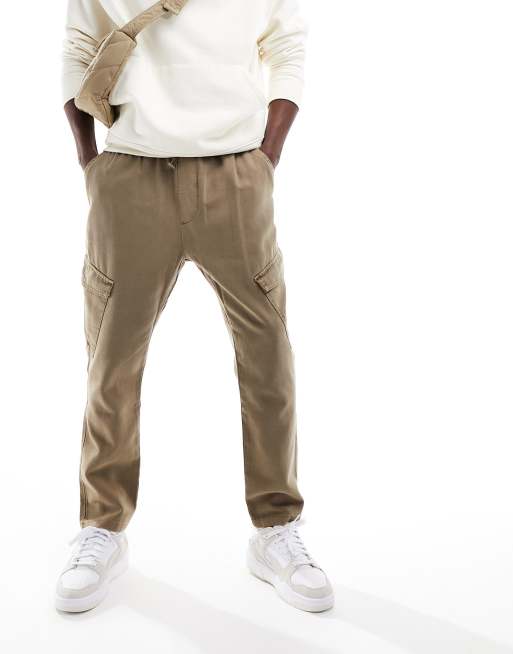 ASOS DESIGN tapered cargo pants in washed brown