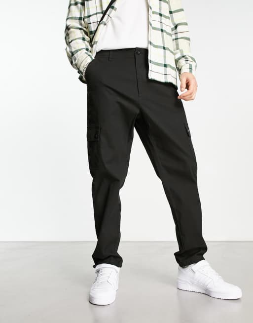 ASOS DESIGN cargo tapered pants in black with toggles