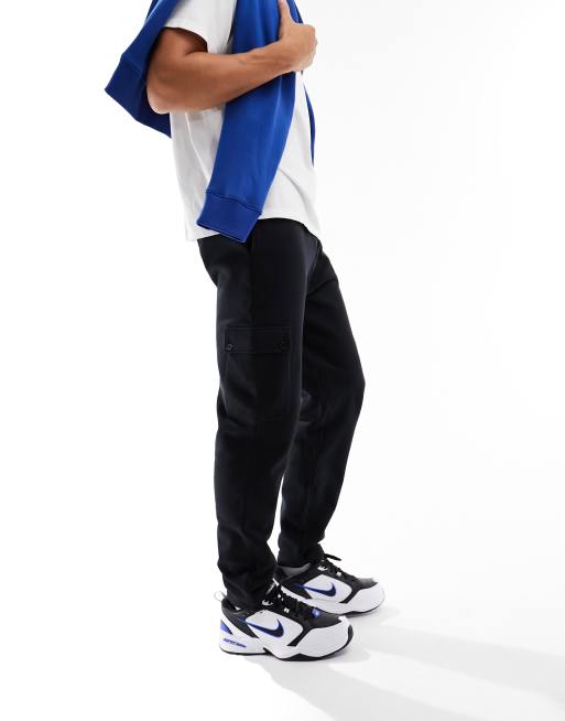 ASOS DESIGN tapered cargo trackies with toggle in black