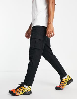 ASOS DESIGN tapered cargo trousers in black with 3D pockets - ASOS Price Checker