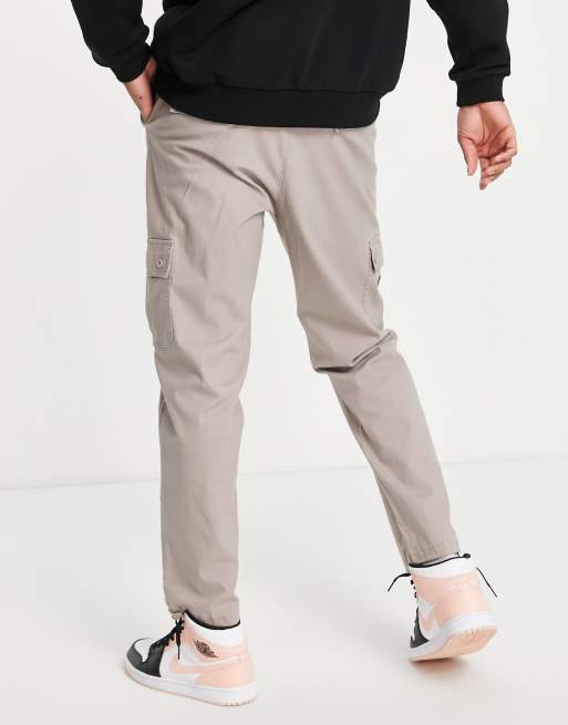 ASOS DESIGN tapered cargo trousers in brown