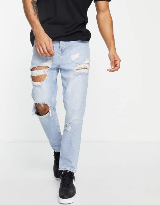 ASOS DESIGN tapered carrot jeans in vintage light wash with heavy rips