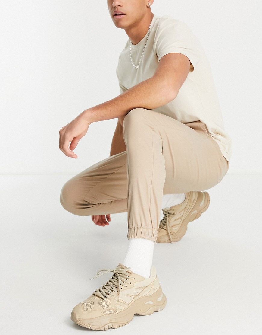 ASOS DESIGN tapered chino joggers in warm beige-Neutral