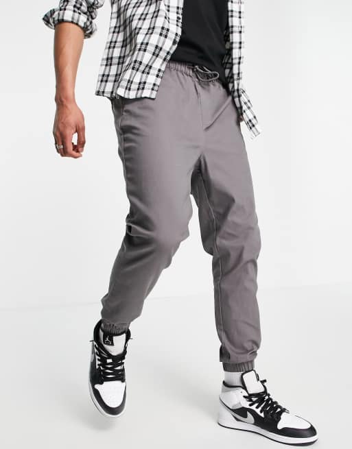 ASOS DESIGN tapered chino joggers with elasticated waist in charcoal ASOS