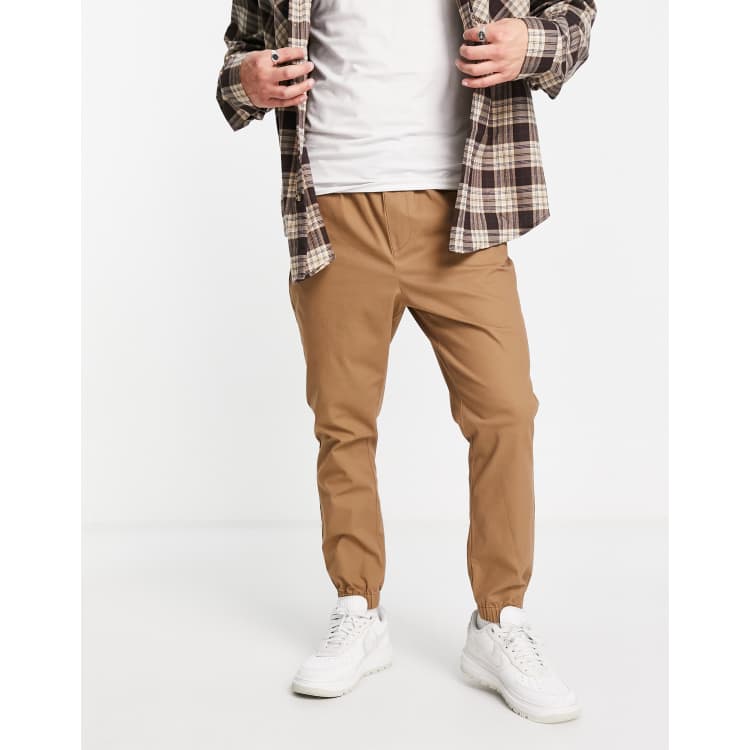 ASOS DESIGN tapered chino joggers with elasticated waist in stone