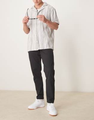 ASOS DESIGN tapered chinos in black - view 1