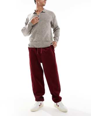 tapered cord pants in burgundy