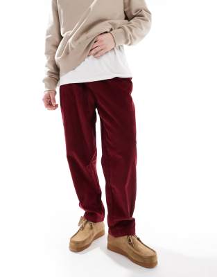 ASOS DESIGN tapered cord trousers in burgundy